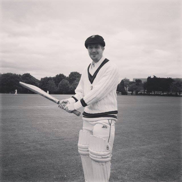 The author, Jim, in an old fashioned cricket pose with the bat and baggy cap