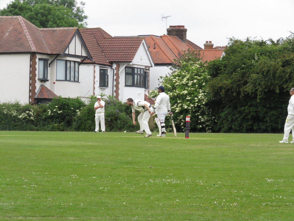 Paul Evans in bowling action against Forest Gate in 2025.