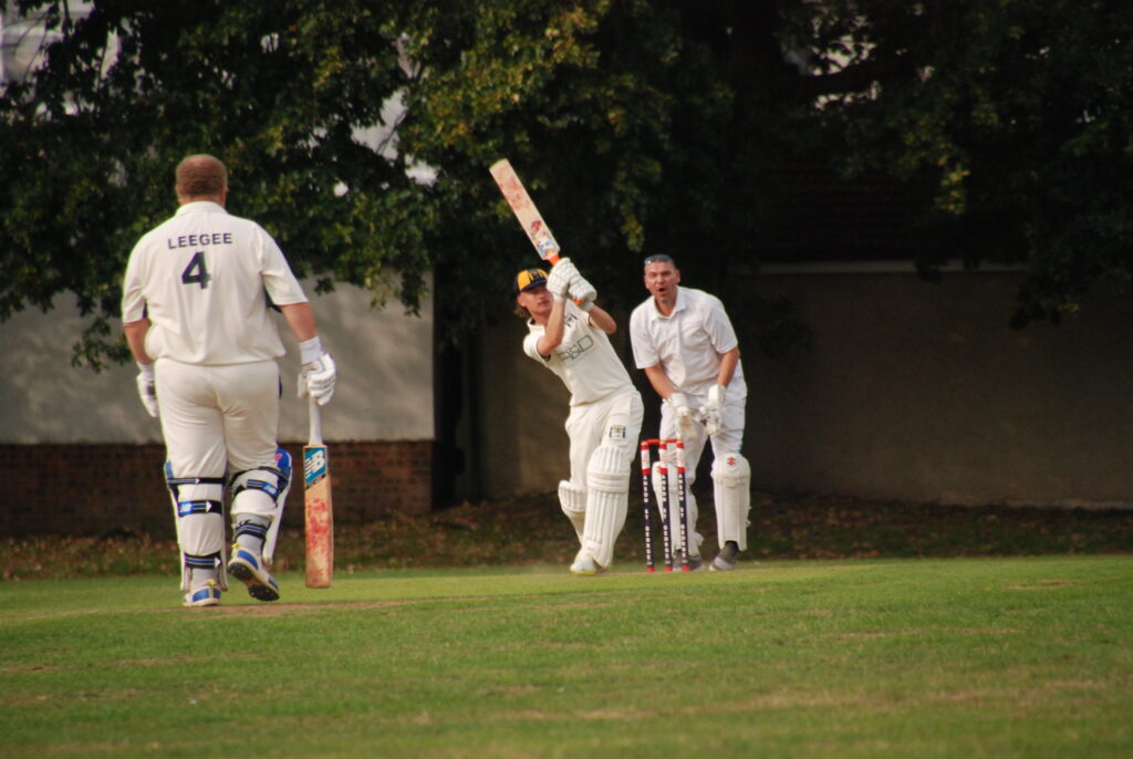 Dane lofts a shot over midwicket for four