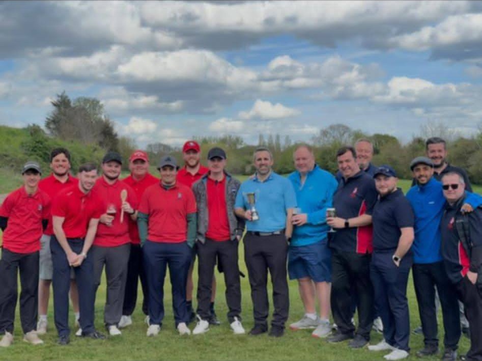 Anson youth in red vs Anson experience in blue stand in line at a recent away day. Steve holds the trophy