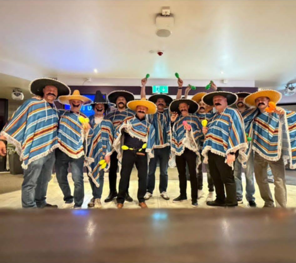 The Anson cricket team in attendance at Butlins dressed in Mexican ponchos and sombreros